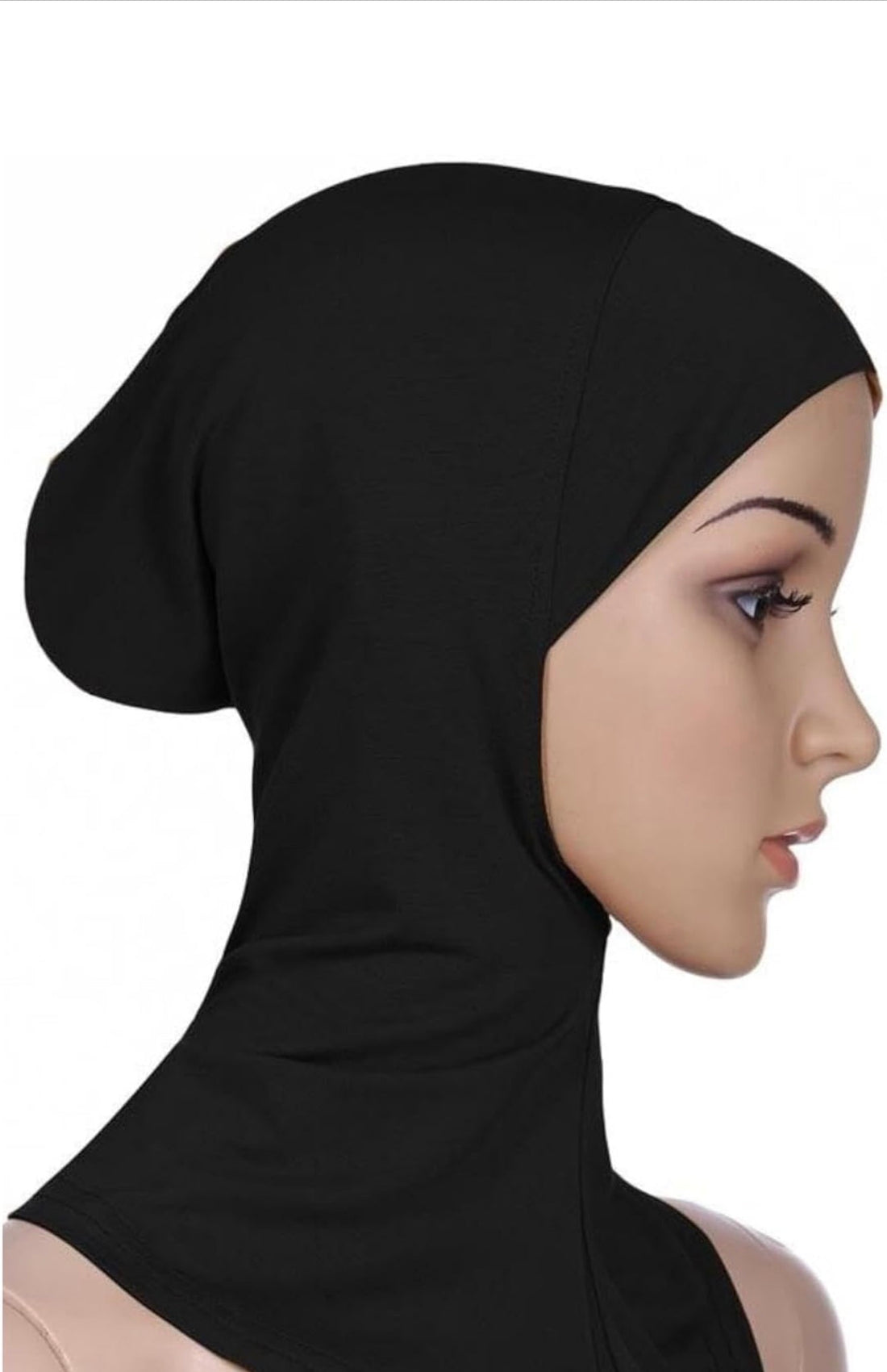 Woman wearing a black hijab on a white background
