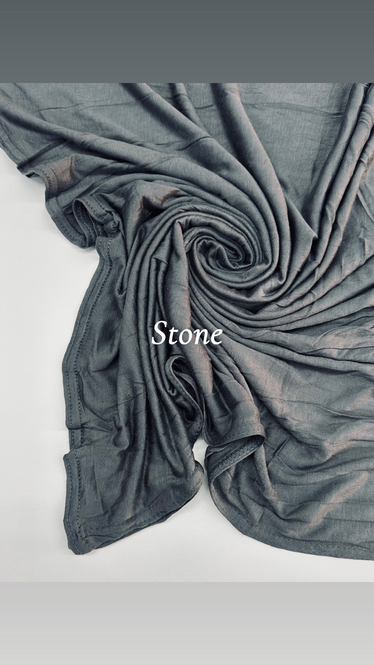 Gray fabric with 'Stone' label on a light gray background